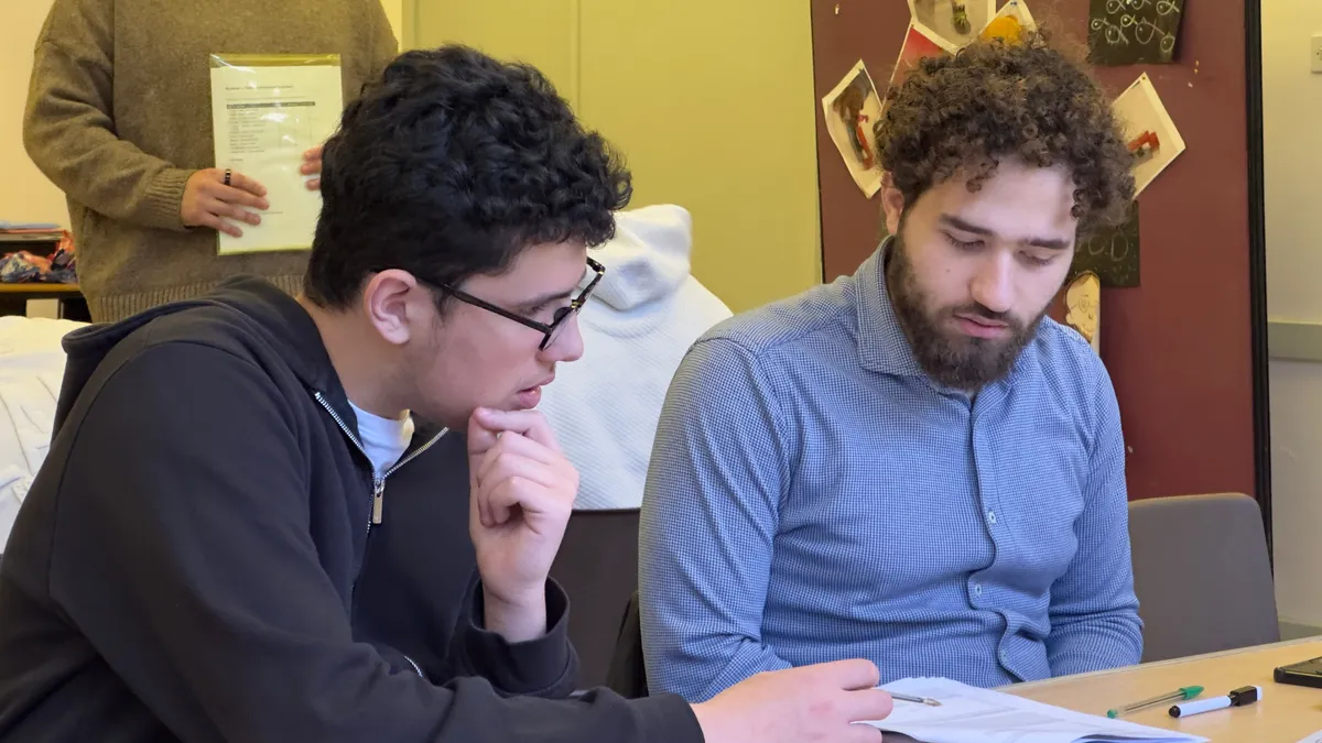 A GradeSmart tutor working one-to-one with a student